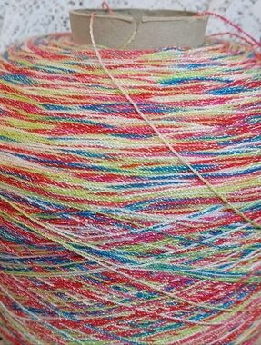 CONE OF VARIEGATED THREAD WITH SILVER METALLIC 2 LBS 5 OZ